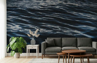 Decorative mural featuring fluid water ripples in rich, immersive blue tones.