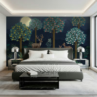 Woodland wall mural in a child’s bedroom with light oak furniture.