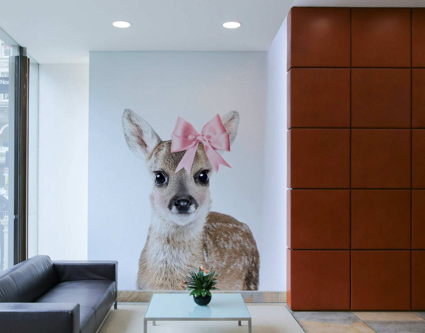Elegant deer with a bow design in wall mural.

