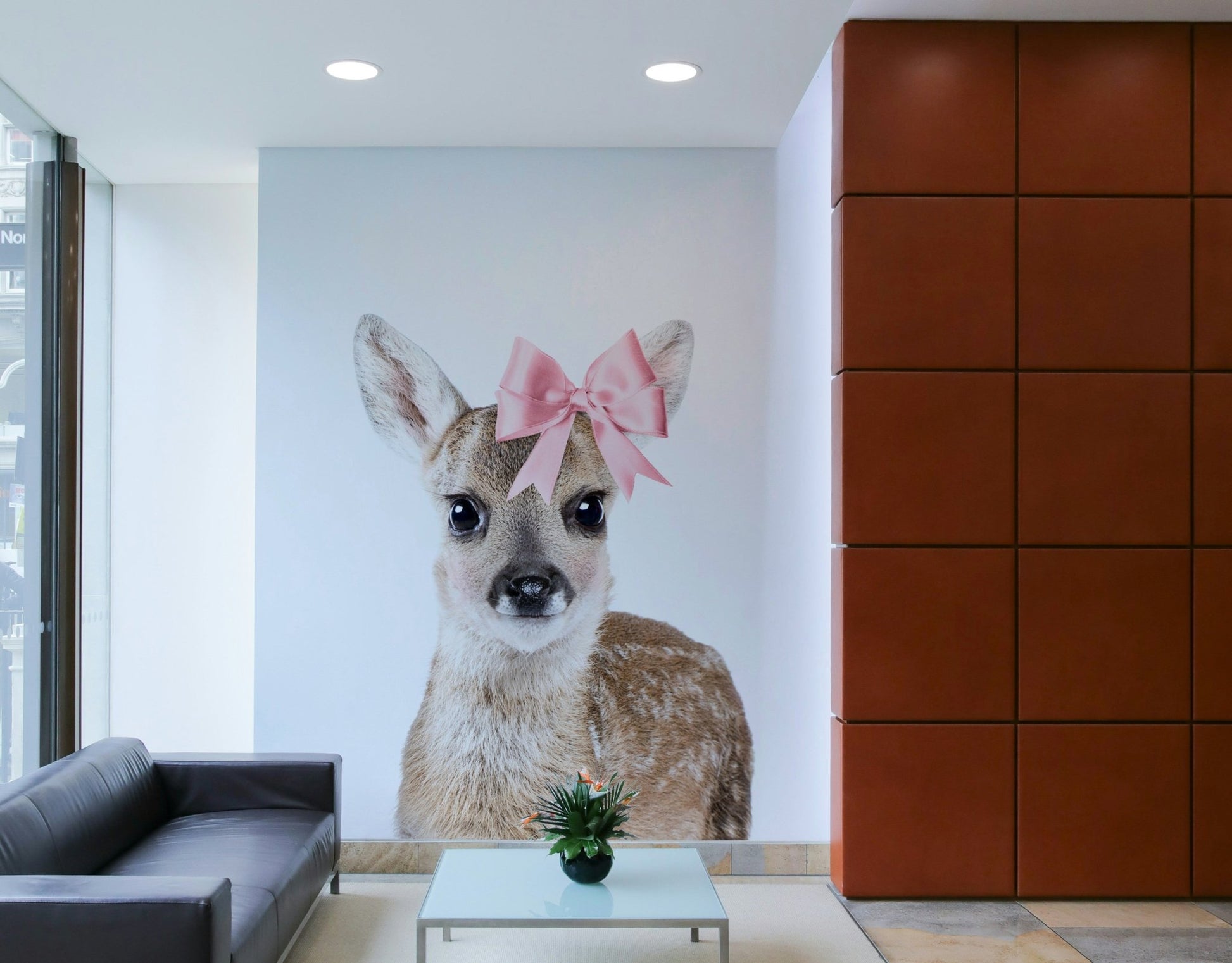 Elegant deer with a bow design in wall mural.

