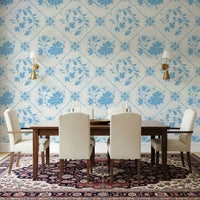 Traditional Delft-style floral wallpaper in dining room, blue blooms on white wall, modern decor