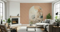 Delicate Bloom Frame wallpaper mural beside a lit fireplace behind a grey sectional and wood coffee table in a living room