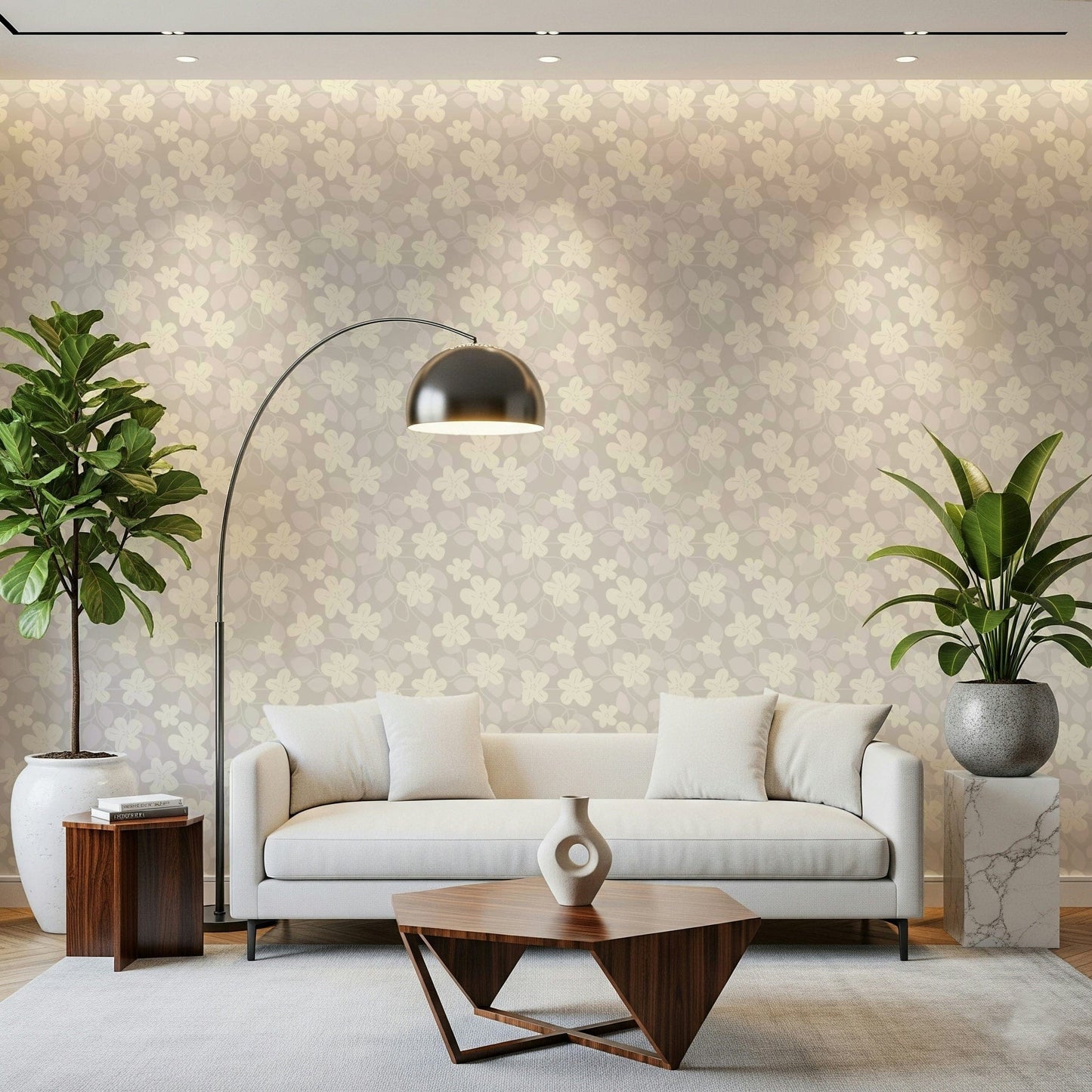 Delicate Floral Serenity wallpaper in cream and beige behind a white sofa with a chrome arc lamp in a living room