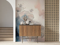 Delicate Floralscape wallpaper mural behind a fluted wood console with pampas grass beside an arched doorway