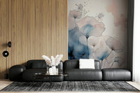 Delicate Floralscape wallpaper mural behind a charcoal modular sofa beside a wood-slat feature wall
