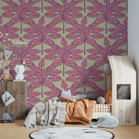 Bold tropical leaves in pink and purple on a warm cream-colored background.

