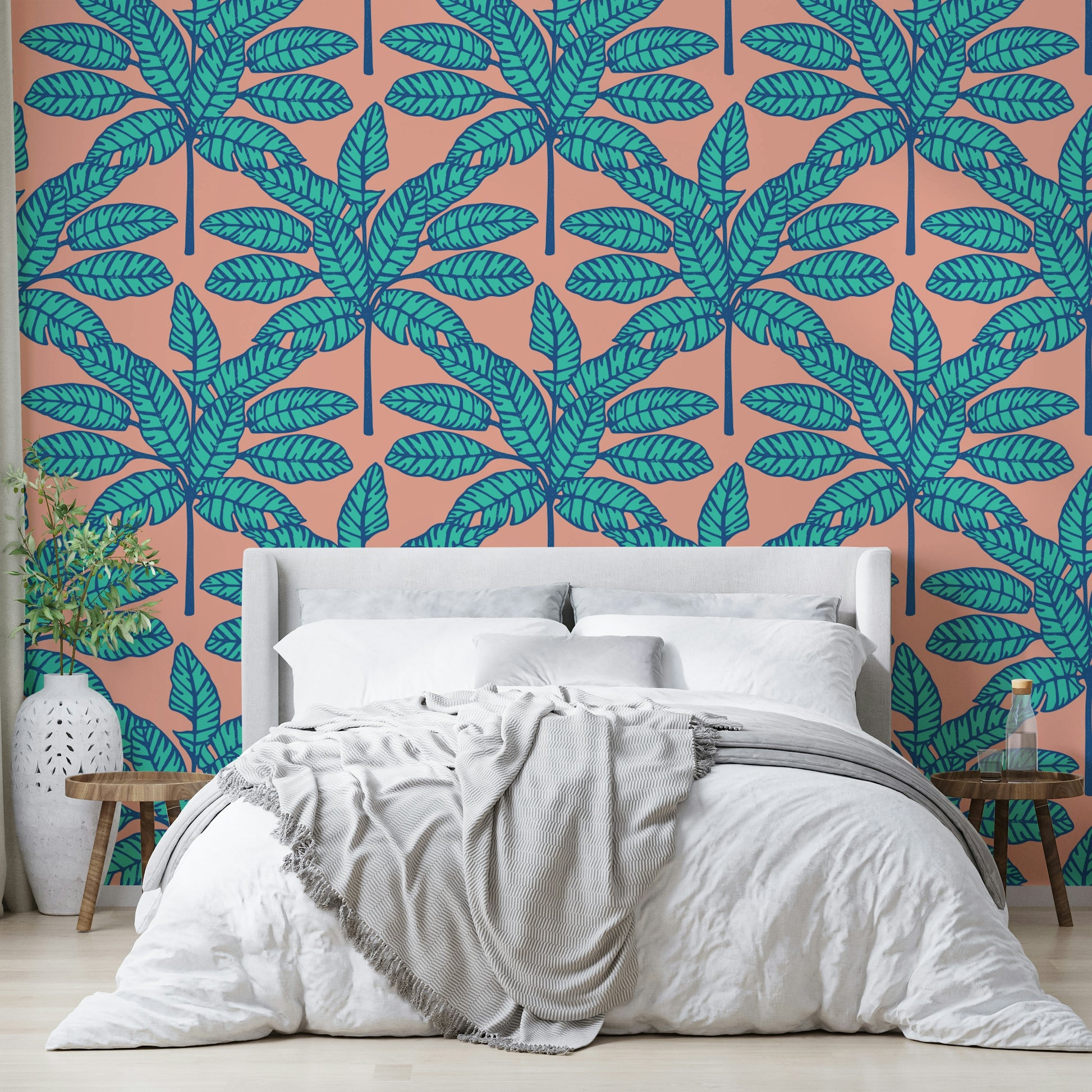 Fun and playful desert-inspired wallpaper with tropical foliage in aqua and pink.

