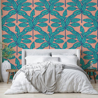 Fun and playful desert-inspired wallpaper with tropical foliage in aqua and pink.

