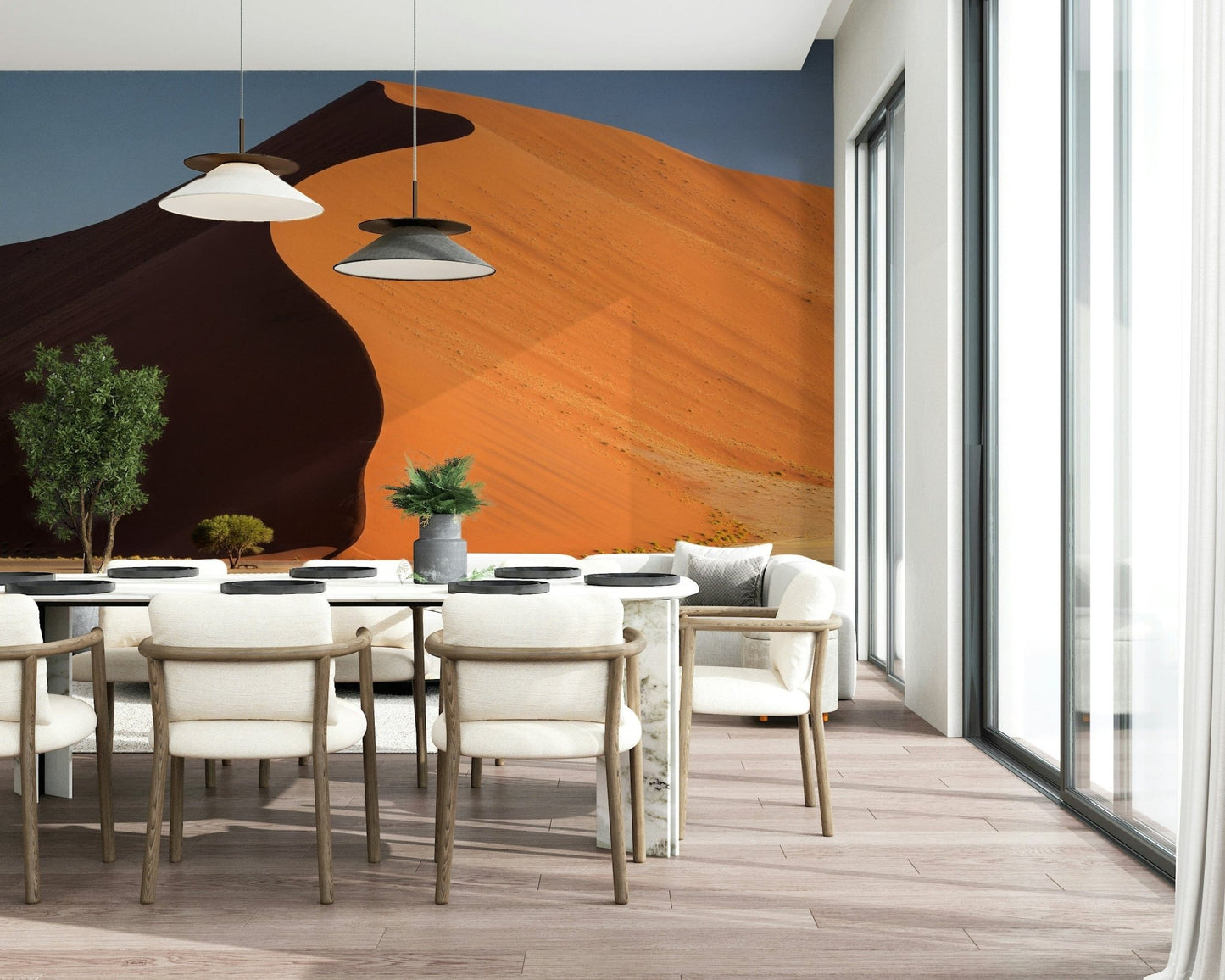 Reading nook with desert dune wall mural, muted sand colours, cosy chair and warm lighting