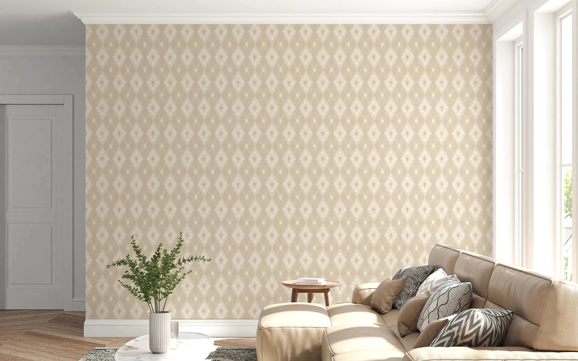 Diamond Bloom wallpaper in neutral floral harlequin pattern behind a tan leather sectional sofa in a bright living room