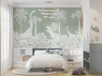 Monochrome Dino Green wallpaper mural with white dino silhouettes behind a grey kids bed under a ring chandelier