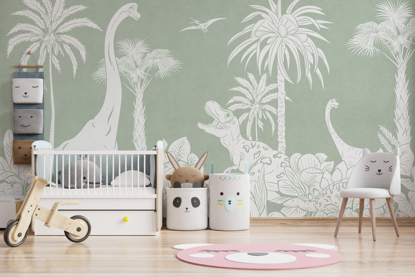Monochrome Dino Green wallpaper mural with white dinosaurs and palms in a nursery with a white crib and balance bike