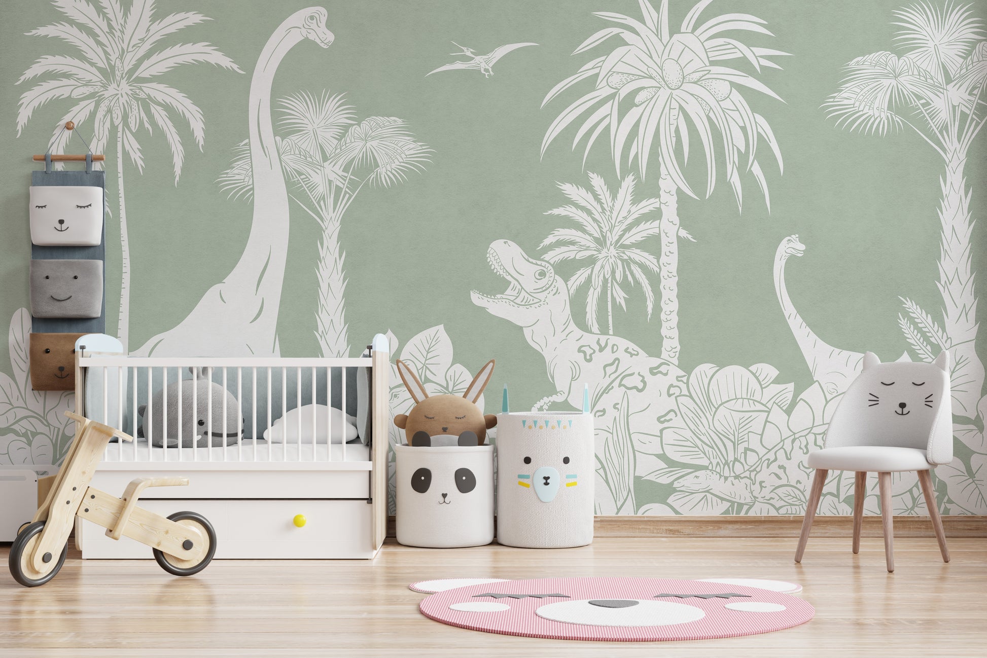 Monochrome Dino Green wallpaper mural with white dinosaurs and palms in a nursery with a white crib and balance bike
