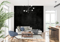 Dirty Paper - Cave wallpaper mural of a dark textured wall behind a cream sofa and blue swivel chair