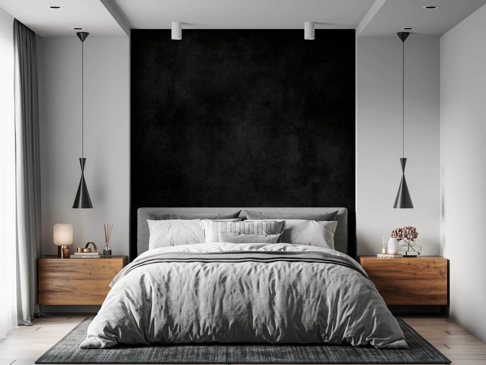 Dirty Paper - Cave wallpaper mural of a black textured wall behind a grey bed flanked by wood nightstands