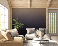 Dirty Paper - Ombre Dusk wallpaper mural of an ombre gradient behind beige sofas under a wood-beam ceiling