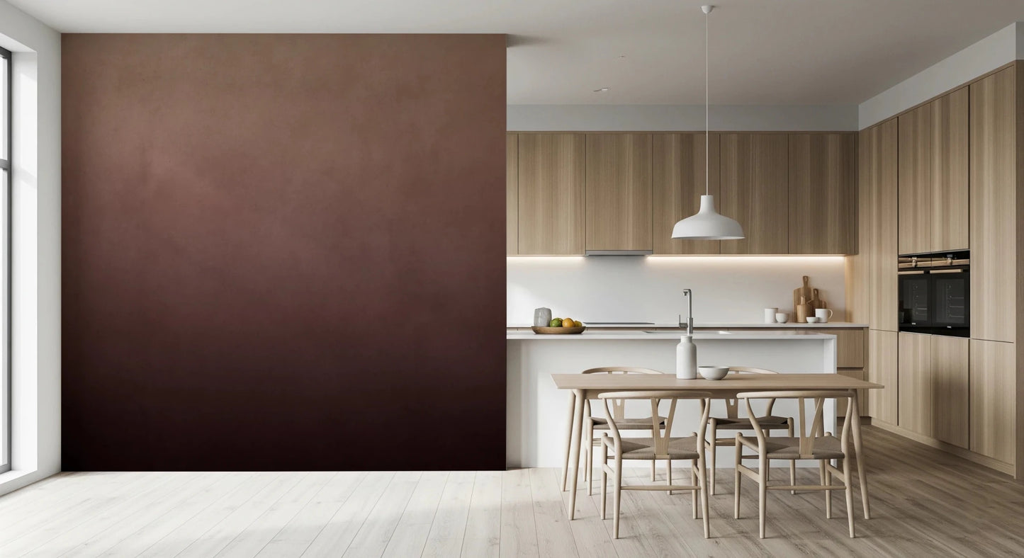 Dirty Paper Ombre Peach wall mural shown beside a minimalist wood kitchen with pale dining table and pendant light