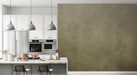Ombre Tobacco wall mural in a white kitchen with copper pots, marble island and pendant lights