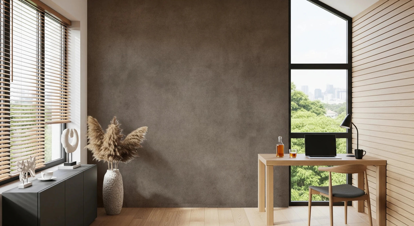 Dirty Paper Taupe wall mural in a home office with light wood desk, chair and pampas grass by a city-view window