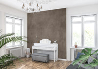 Dirty Paper Taupe wall mural in a music room with a white upright piano and grey bench between bright windows