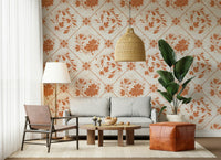 Vintage floral square pattern wallpaper behind bed in bedroom, soft beige and green tones