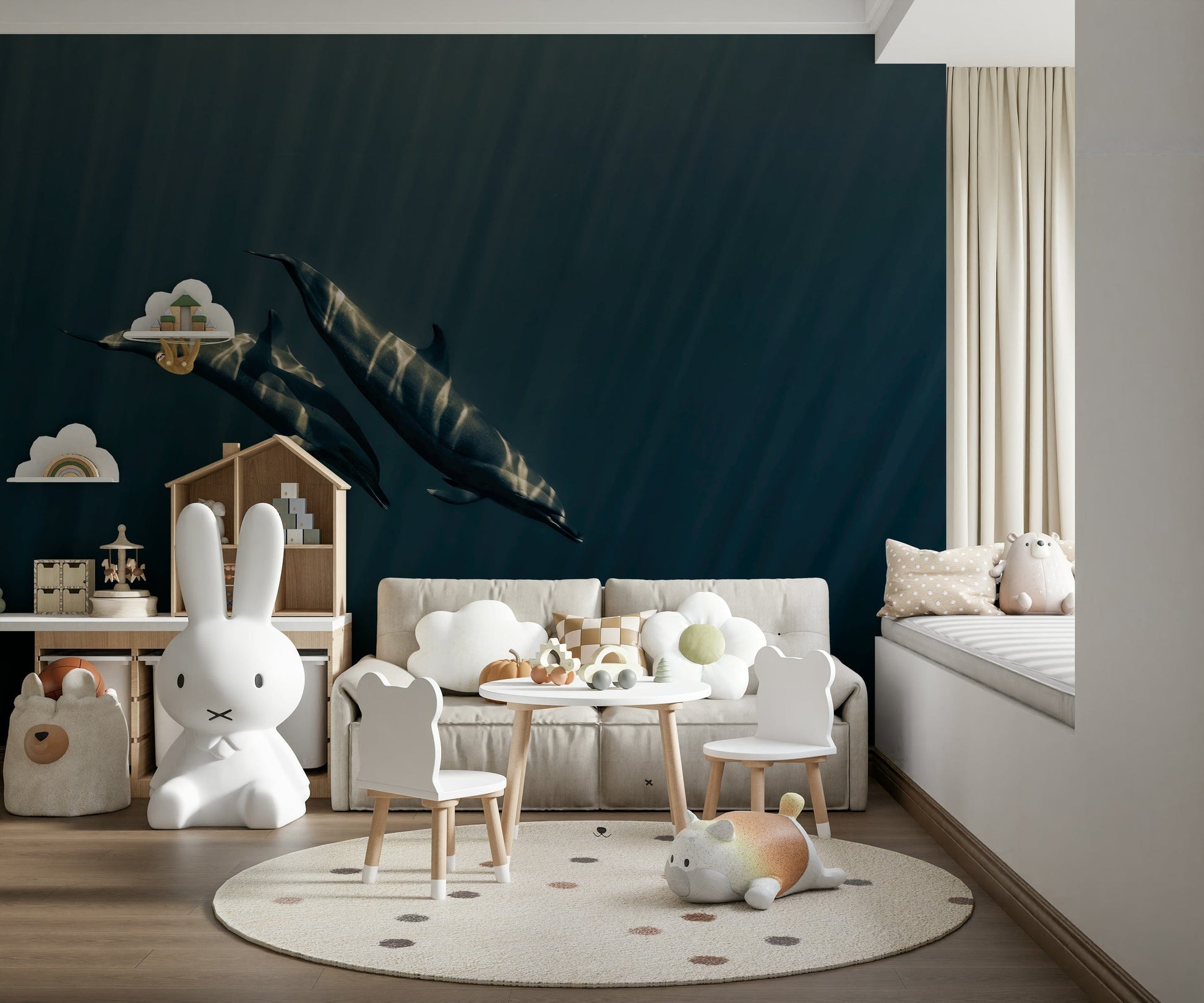 Deep Blue Journey wallpaper mural of two dolphins in deep blue sea behind a beige sofa and bear chairs in a kids playroom