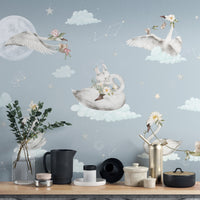Celestial swan wallpaper for a dreamy kids' room

