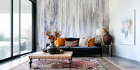 Textured wall mural with flowing drip patterns creating a peaceful, artistic accent wall.