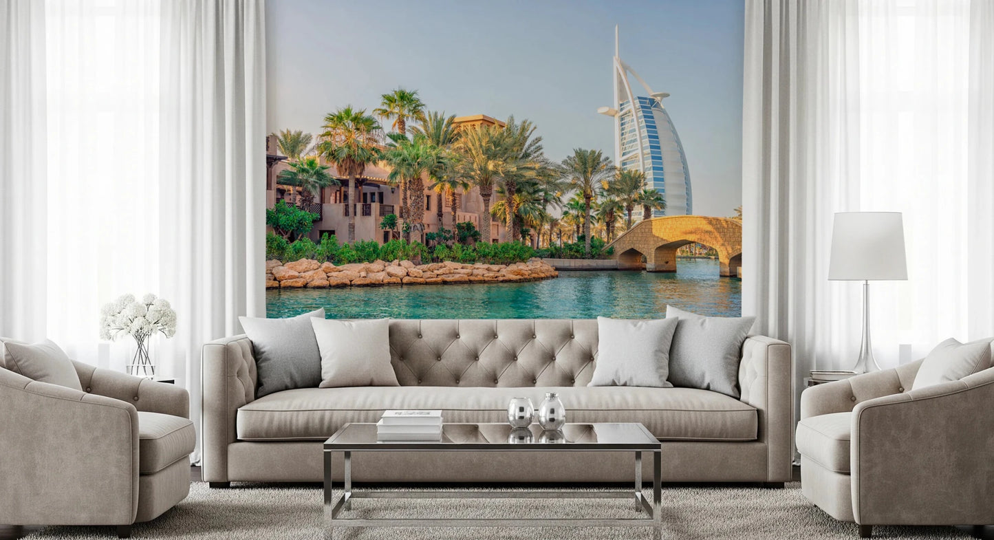 Dubai Oasis wallpaper mural of the Burj Al Arab and palms behind a beige tufted sofa in a living room