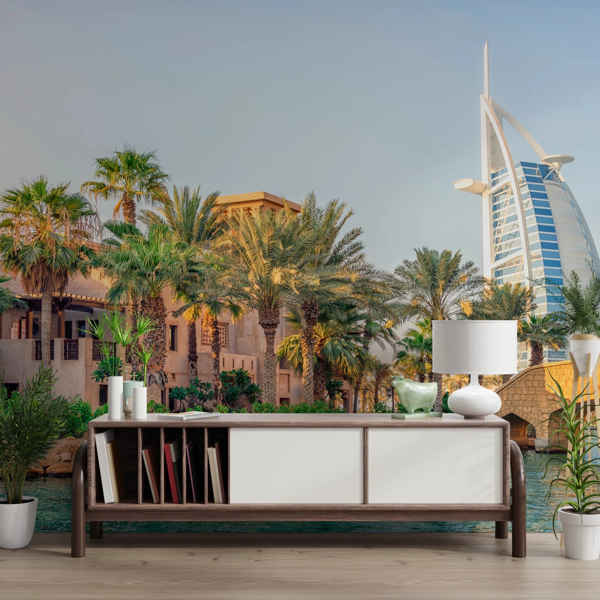 Dubai Oasis wallpaper mural of palms and the Burj Al Arab above a wood console in a slat-ceilinged living room