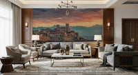 Scenic wall mural showcasing Antibes at twilight with stone buildings and distant mountain peaks.
