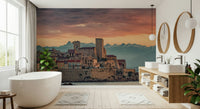 Romantic sunset mural of Antibes with layered mountains and a softly lit sky.