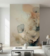 Dusky Ink Petals wallpaper mural with blush and teal alcohol-ink flowers behind a grey sofa and marble coffee table