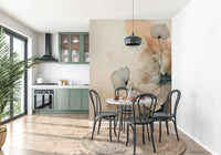 Dusky Ink Petals wallpaper mural behind a terrazzo table and black bentwood chairs in a sage green kitchen diner