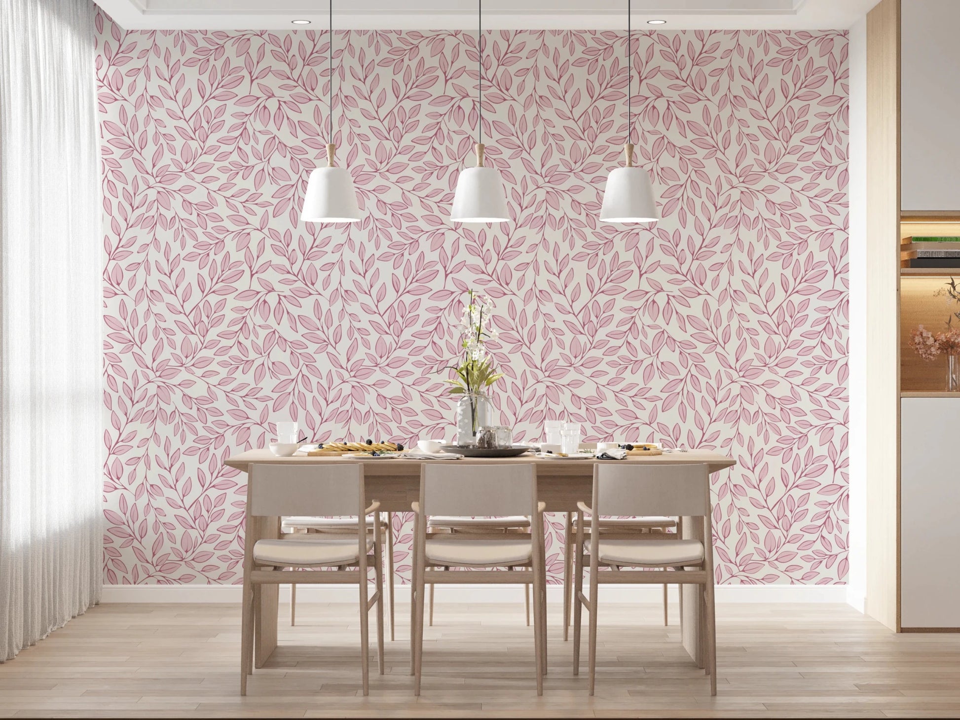 Dusty Rose Vines wallpaper with pink leaves behind a light wood dining table under three white pendant lights