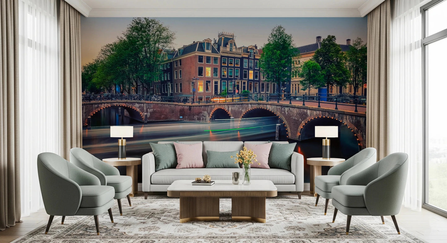 Dutch Canal Dreams wallpaper mural of the lit canal and bridge above a grey sofa flanked by armchairs and lamps