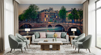 Dutch Canal Dreams wallpaper mural of the lit canal and bridge above a grey sofa flanked by armchairs and lamps