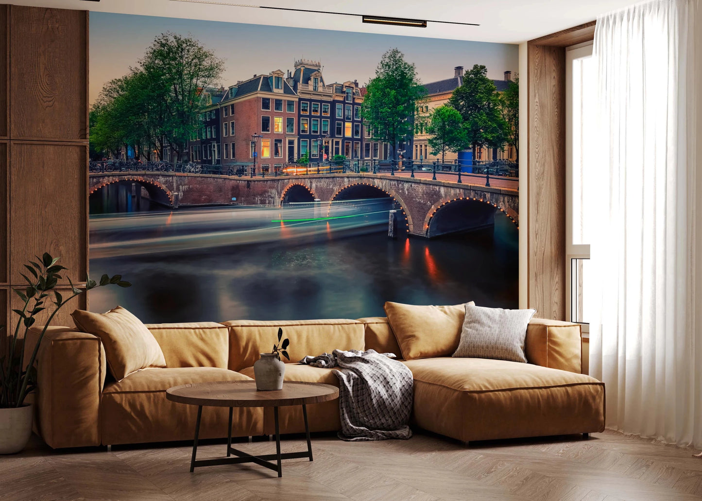 Dutch Canal Dreams wallpaper mural of the glowing canal at dusk above a tan leather sectional in a living room