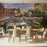 Dutch Waterways wallpaper mural of moored canal boats behind a wood dining table with beige chairs