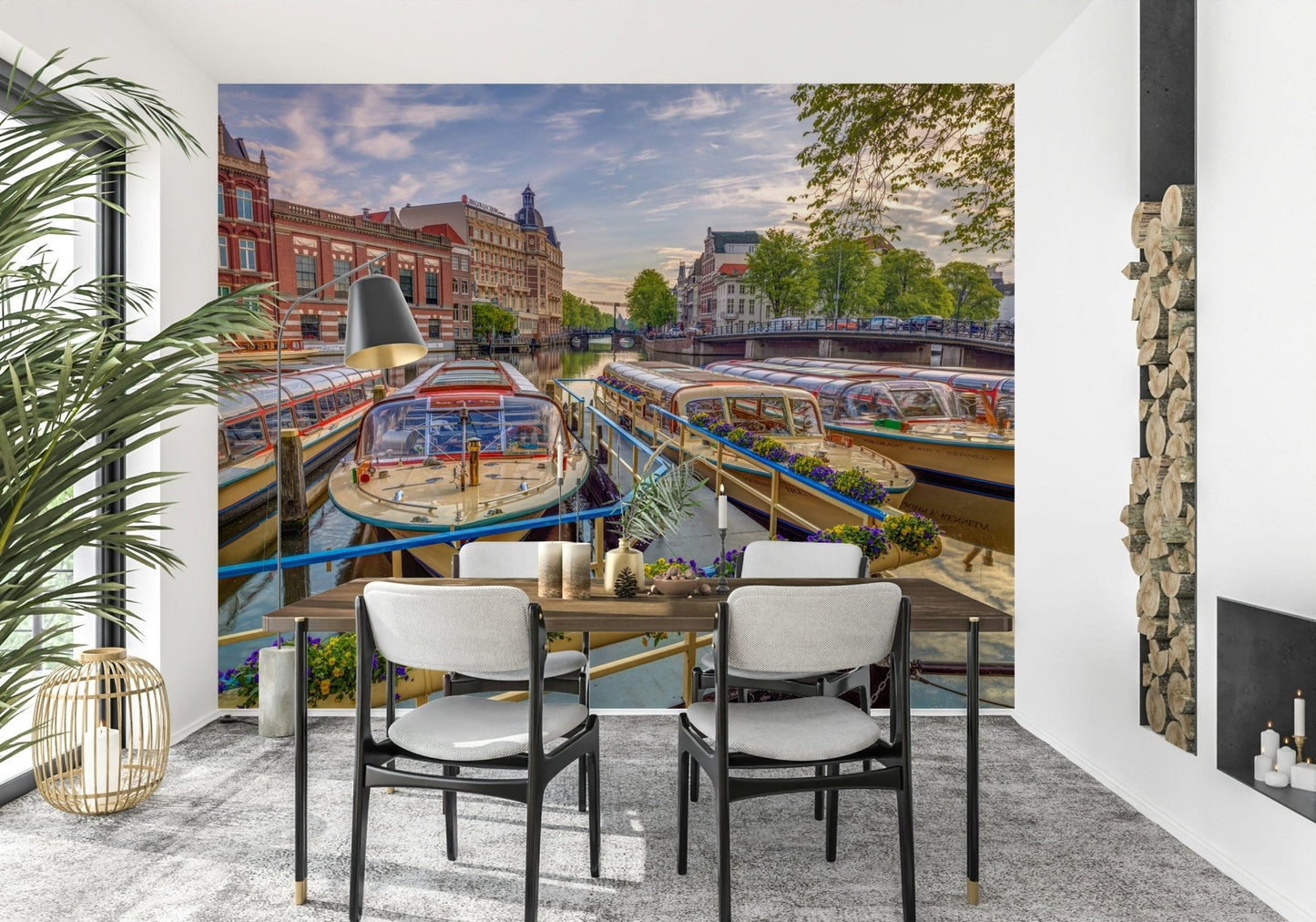 Dutch Waterways wallpaper mural of canal boats behind a wood dining table with black chairs near a fireplace