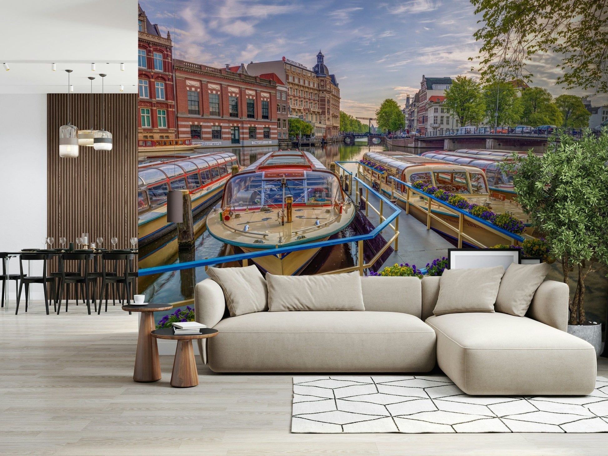 Dutch Waterways wallpaper mural of canal boats behind a beige sectional sofa by a wood-slat divider in a living room