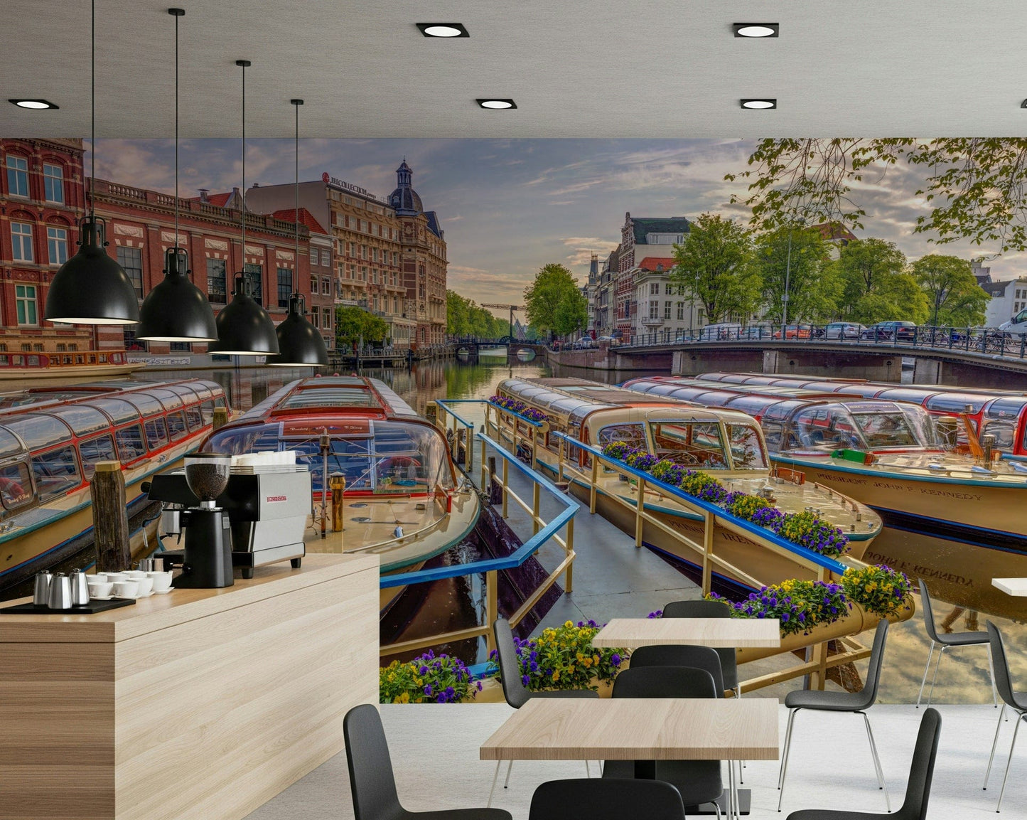 Dutch Waterways wallpaper mural of canal tour boats behind a cafe counter with espresso machine and tables