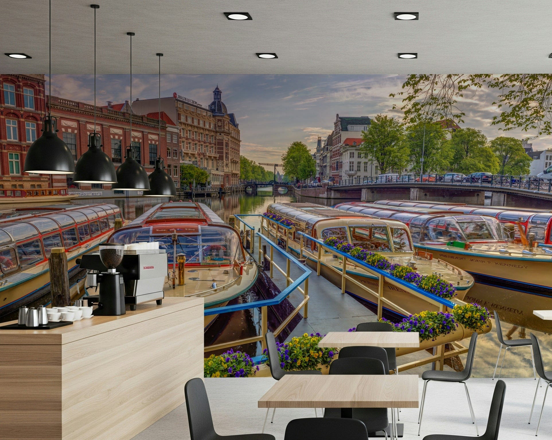 Dutch Waterways wallpaper mural of canal tour boats behind a cafe counter with espresso machine and tables