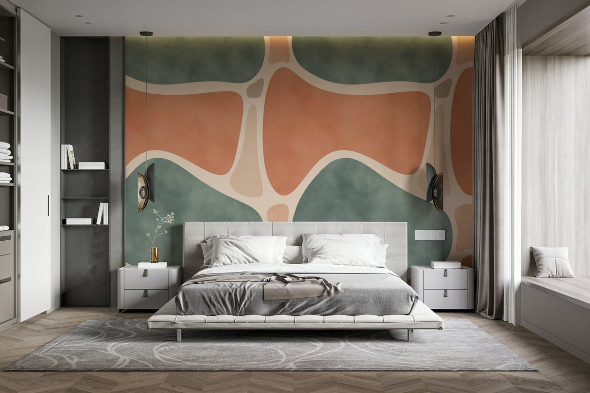 Earth Tones Shapes wallpaper mural in terracotta and sage green behind a low platform bed in a modern bedroom