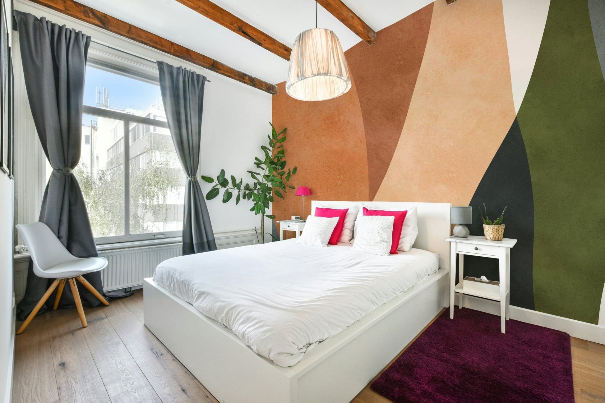 A modern wall mural with a repeating geometric arch pattern.

