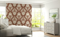 Earthy floral echo wallpaper featuring cream botanical motifs on a rich terracotta brown background
