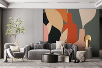 Earthy Hues Bottle Decor wallpaper mural close-up in terracotta and cream above a grey sofa in a living room