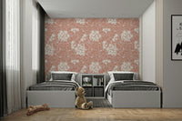 Large scale botanical print behind a cream sofa in a modern apartment.