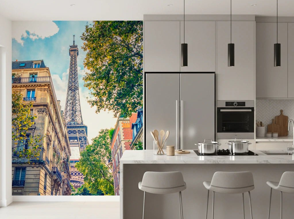 Eiffel Elegance wallpaper mural of the Eiffel Tower down a Paris street beside a grey kitchen and marble island