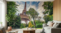 Eiffel Tower Greens wallpaper mural showing the Eiffel Tower behind a gray sofa and wood-slat wall in a living room